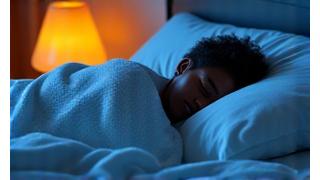 Person sleeping peacefully in a dimly lit room